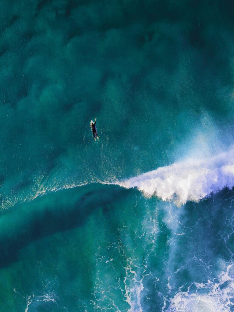 Surfer walking with board near Coiba coast