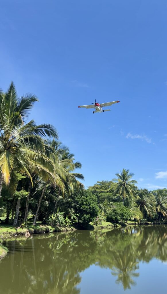 View from small plane window over Pacific coastline