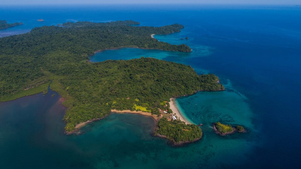 Snorkeler floating over clear turquoise water in Coiba