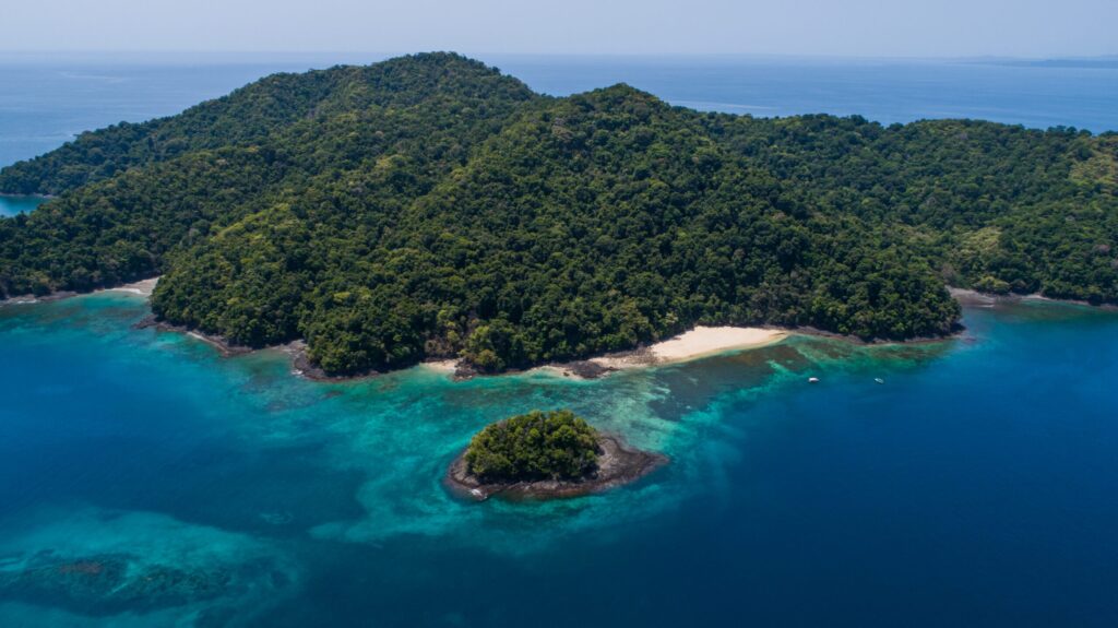 Soft morning light over Coiba coastline and sea