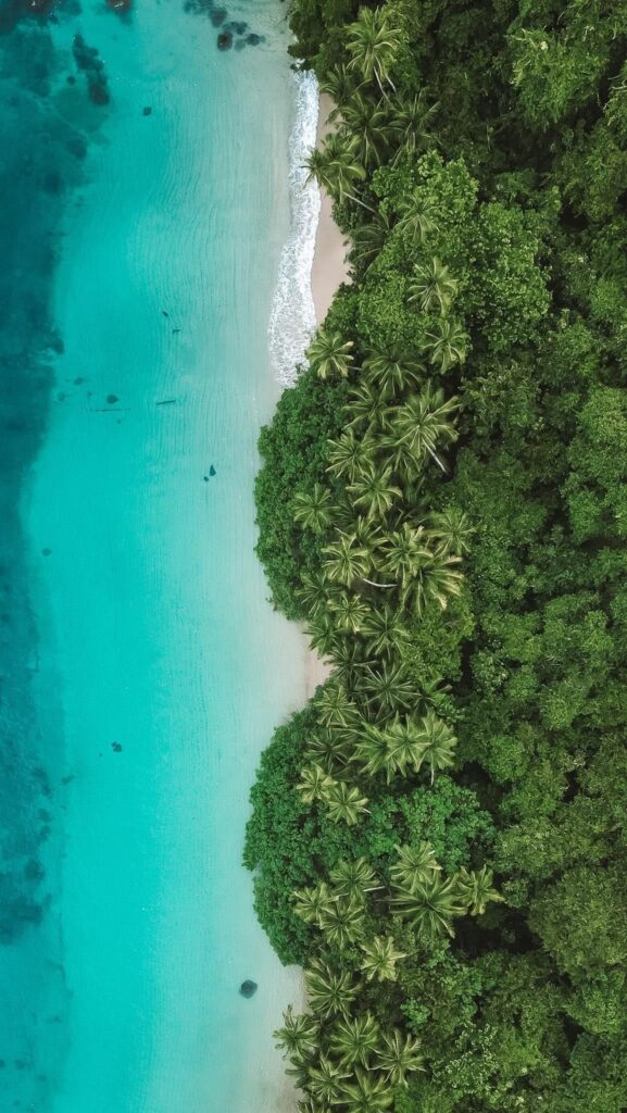 Scenic coastal cliffs and Pacific water by Coiba Island