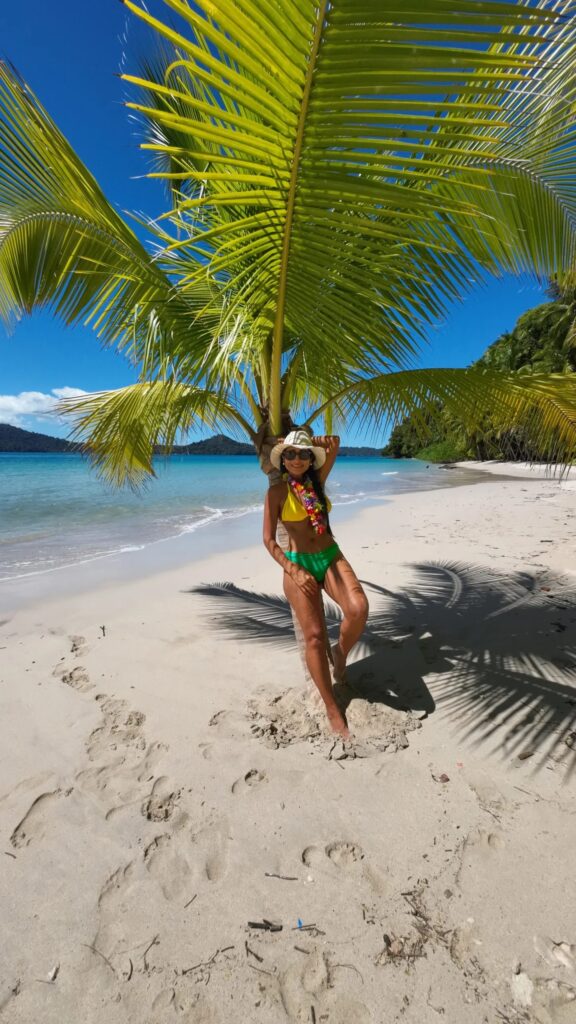 Snorkeler floating near rocky coastline in Coiba