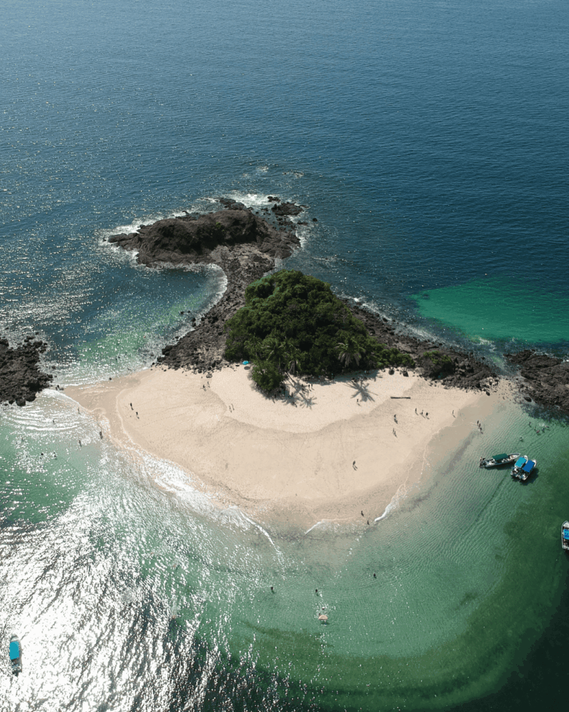 Traveler standing on sandbar near Coiba Island