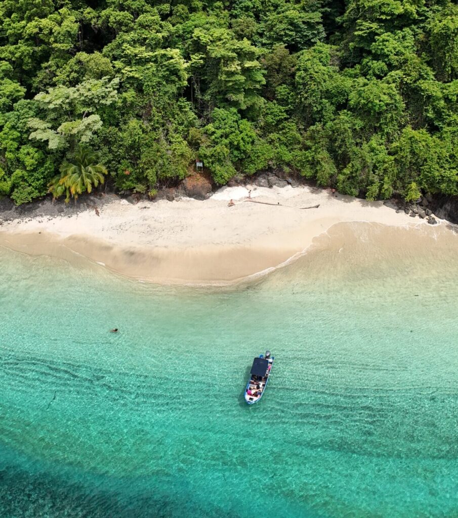 Tour boat moving through calm Pacific near Coiba